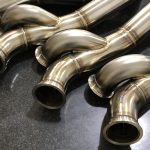 Custom stainless steel aircraft engine exhaust manifold tubes fabricated by Mace Aviation