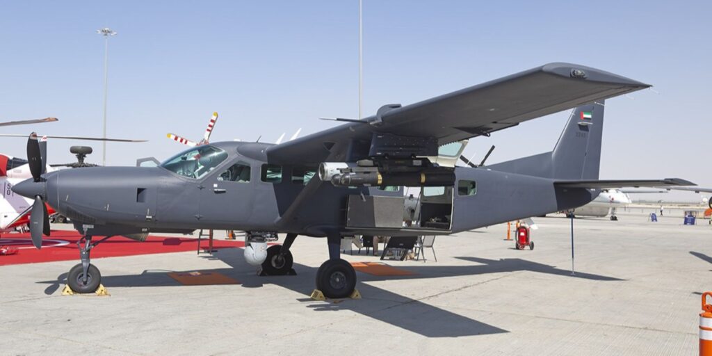 UAE military Cessna Caravan surveillance aircraft with sensor and weapon bay open, displayed at airshow